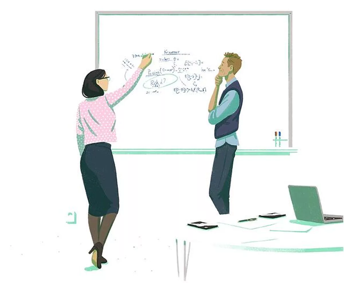 Woman writes mathematics on a whiteboard next to a man who is pondering