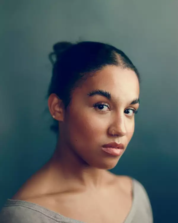 Headshot of Romaya Weaver wearing a grey top
