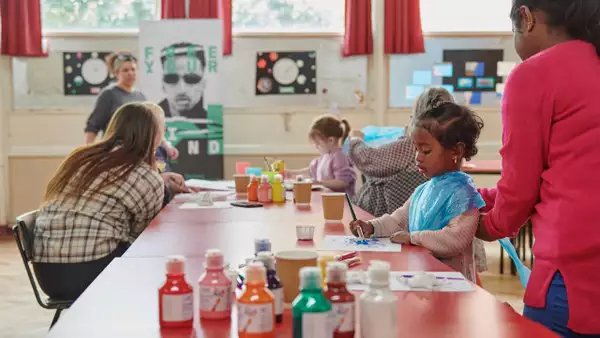 Photo of families painting together