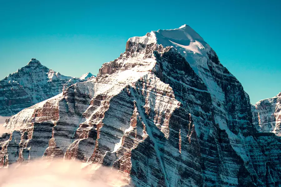 A picture of mountains against a blue sky