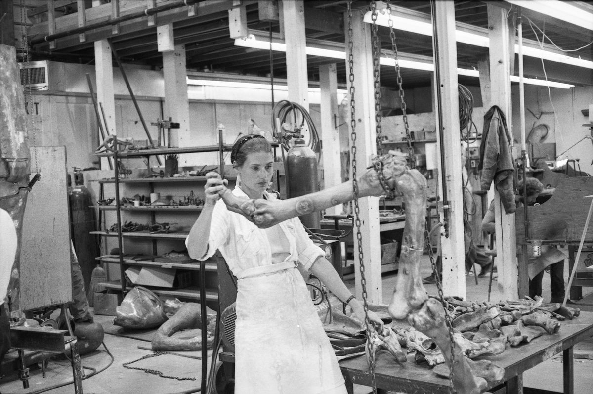 Nancy Graves inspects a bronze cast of a camel bone, thought to be for her work 'Ceridwen, out of fossils' at Tallix Foundry, 1977