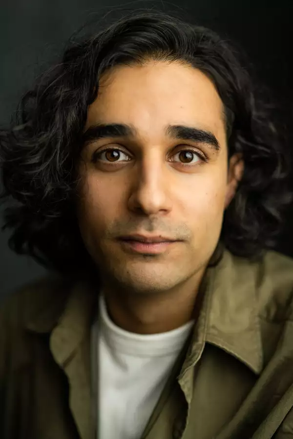 Rayo Patel in a green shirt over a white t-shirt